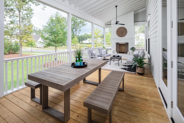 sunroom / solarium featuring vaulted ceiling and ceiling fan