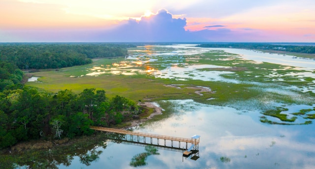 aerial view at dusk with a water view