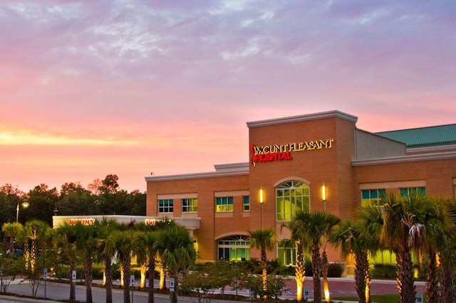 view of outdoor building at dusk