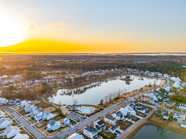 aerial view at dusk with a water view