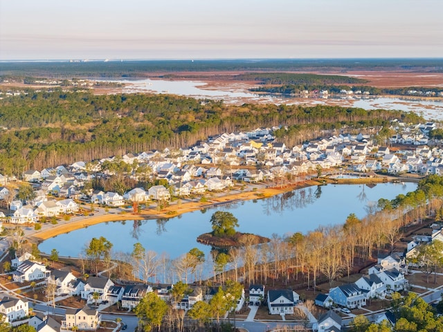 aerial view at dusk with a water view