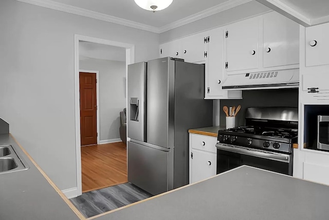 1113 Smithfield Pl, Hanahan, SC 29410 - kitchen with white cabinets, stainless steel fridge, gas range, ventilation hood, and crown molding