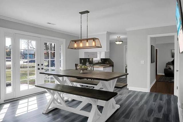 1113 Smithfield Pl, Hanahan, SC 29410 - dining space featuring crown molding, dark wood-type flooring, visible vents, french doors, and baseboards