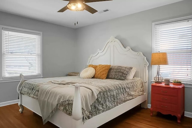 1113 Smithfield Pl, Hanahan, SC 29410 - bedroom with wood finished floors, baseboards, multiple windows, and visible vents