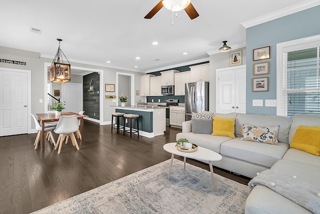4235 Scharite St, Charleston, SC 29414 - living area featuring ornamental molding, a ceiling fan, recessed lighting, dark wood-style floors, and baseboards