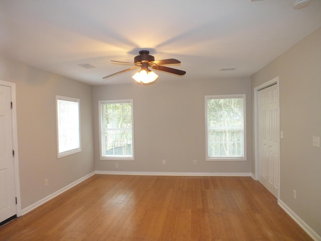 418 Meritta Ave, Beaufort, SC 29902 - empty room featuring light wood-style floors, healthy amount of natural light, and ceiling fan