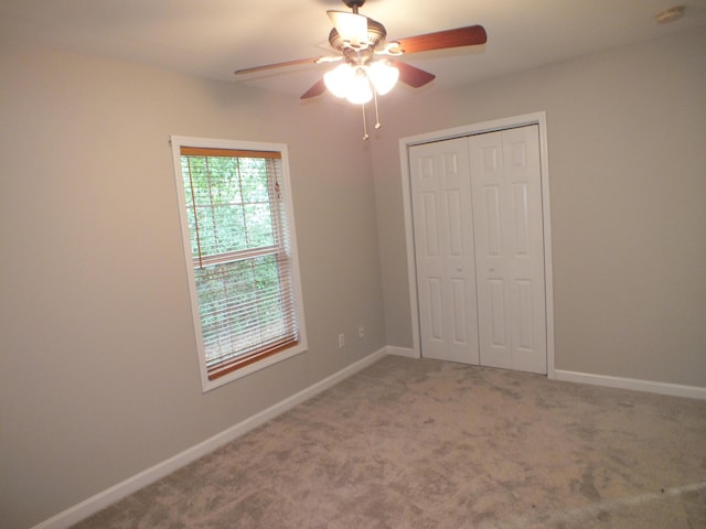 418 Meritta Ave, Beaufort, SC 29902 - unfurnished bedroom featuring a closet, carpet floors, baseboards, and ceiling fan