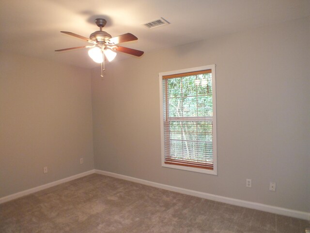 418 Meritta Ave, Beaufort, SC 29902 - carpeted spare room with a ceiling fan and baseboards