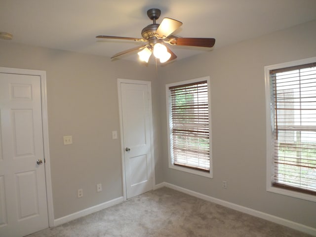 418 Meritta Ave, Beaufort, SC 29902 - unfurnished room featuring a ceiling fan, light colored carpet, and baseboards