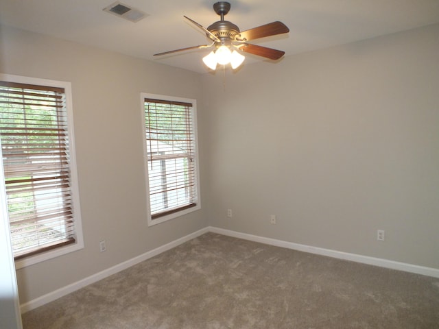 418 Meritta Ave, Beaufort, SC 29902 - spare room featuring carpet flooring, ceiling fan, and baseboards