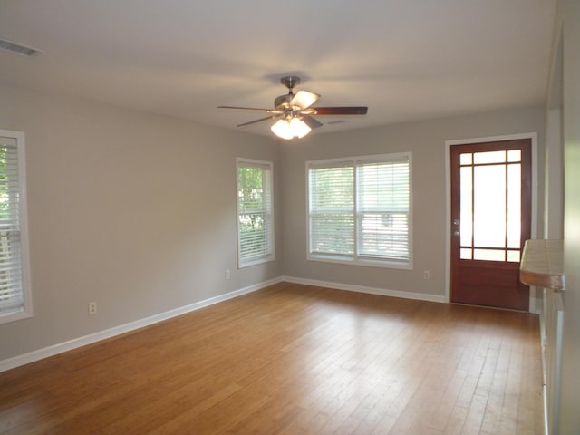 418 Meritta Ave, Beaufort, SC 29902 - empty room with baseboards, plenty of natural light, and a ceiling fan
