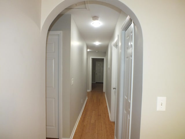 418 Meritta Ave, Beaufort, SC 29902 - hall with light wood-style floors, baseboards, and arched walkways