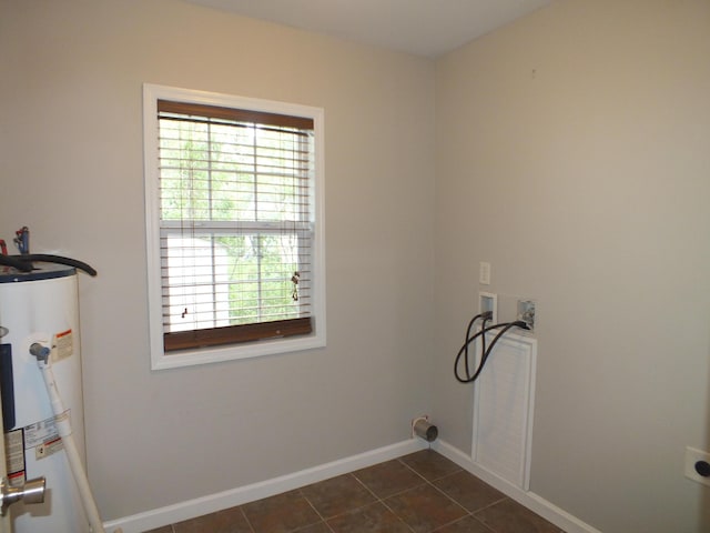 418 Meritta Ave, Beaufort, SC 29902 - washroom with water heater, washer hookup, electric dryer hookup, baseboards, and dark tile patterned floors