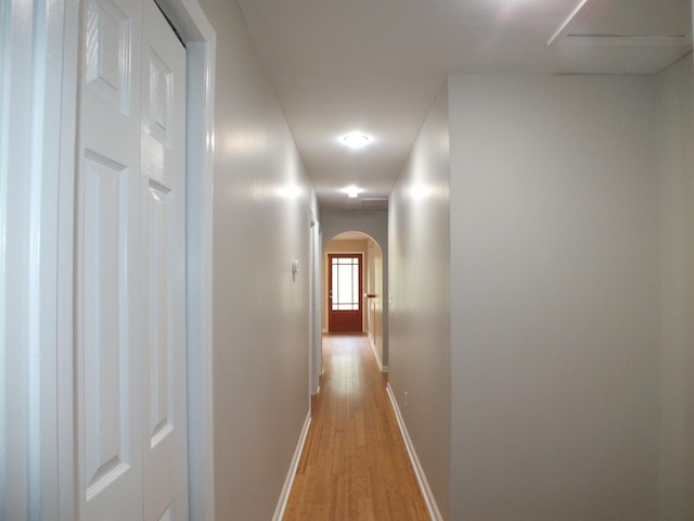 418 Meritta Ave, Beaufort, SC 29902 - hallway with light wood-type flooring, arched walkways, baseboards, and recessed lighting