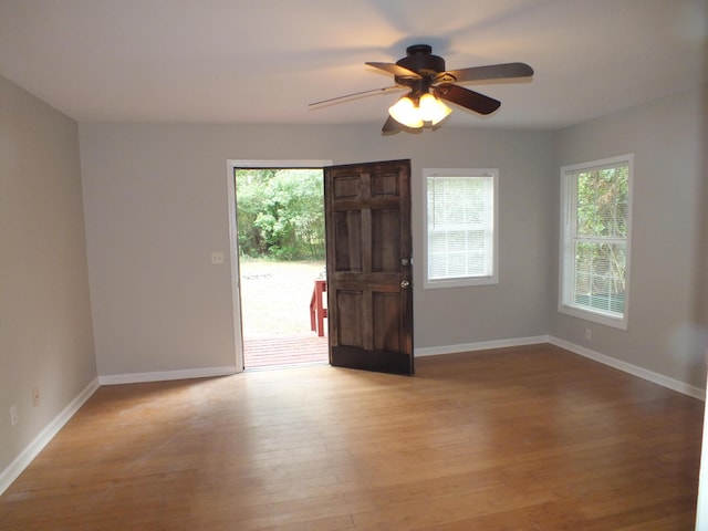 418 Meritta Ave, Beaufort, SC 29902 - empty room featuring healthy amount of natural light, light wood-style floors, a ceiling fan, and baseboards