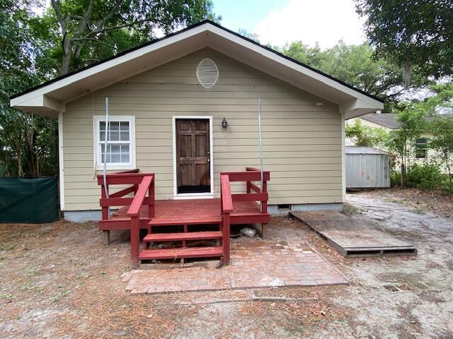418 Meritta Ave, Beaufort, SC 29902 - rear view of property featuring a wooden deck and an outbuilding