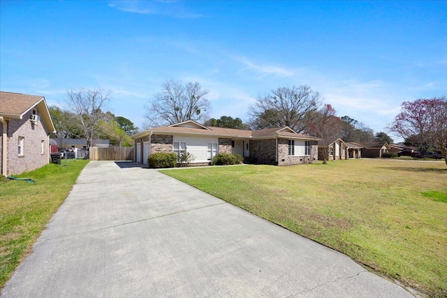 single story home with fence, driveway, a front lawn, a garage, and brick siding