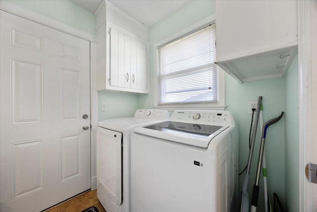 laundry area featuring cabinet space and washing machine and dryer