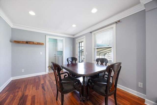 dining area with baseboards, separate washer and dryer, dark wood-style flooring, and ornamental molding