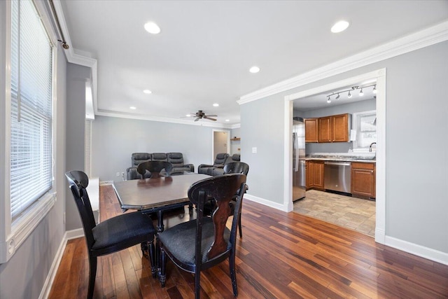 dining space with baseboards, ceiling fan, ornamental molding, recessed lighting, and hardwood / wood-style flooring