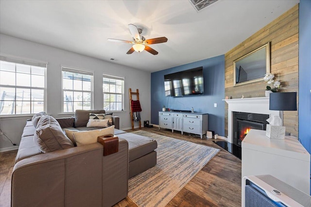 707 Redbud Ln, Summerville, SC 29486 - living room with wood finished floors, plenty of natural light, a glass covered fireplace, and ceiling fan