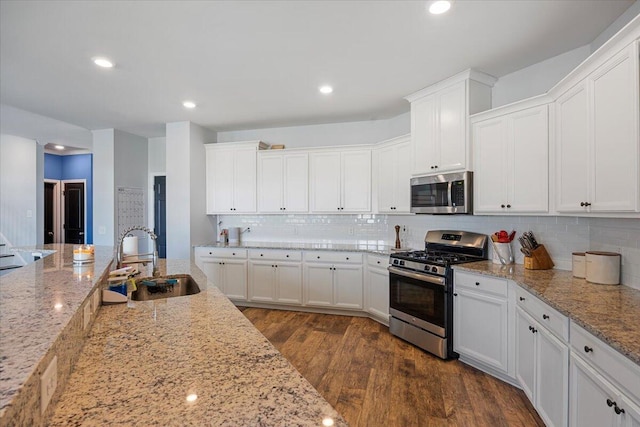 707 Redbud Ln, Summerville, SC 29486 - kitchen featuring white cabinetry, a sink, stainless steel appliances, and dark wood finished floors