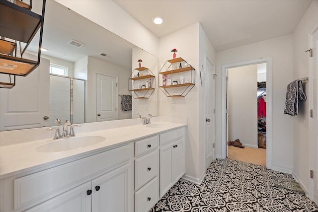 707 Redbud Ln, Summerville, SC 29486 - bathroom featuring visible vents, a sink, double vanity, and a shower stall