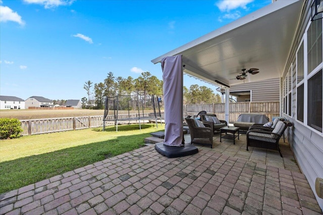 707 Redbud Ln, Summerville, SC 29486 - view of patio / terrace with an outdoor hangout area, a trampoline, a ceiling fan, and a fenced backyard
