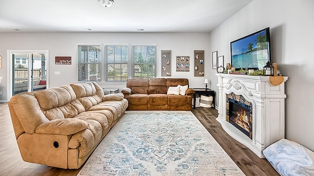 5138 Preserve Blvd, Ladson, SC 29456 - living area featuring dark wood-style flooring and a glass covered fireplace