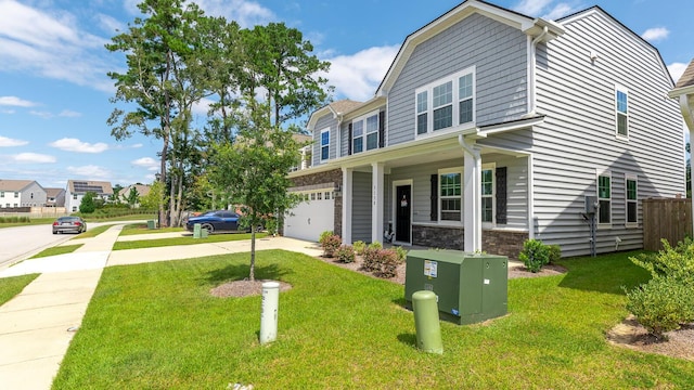 5138 Preserve Blvd, Ladson, SC 29456 - view of front of property with concrete driveway, a front yard, a garage, and stone siding