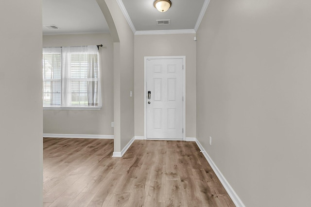 5138 Preserve Blvd, Ladson, SC 29456 - foyer entrance with ornamental molding, arched walkways, wood finished floors, and baseboards
