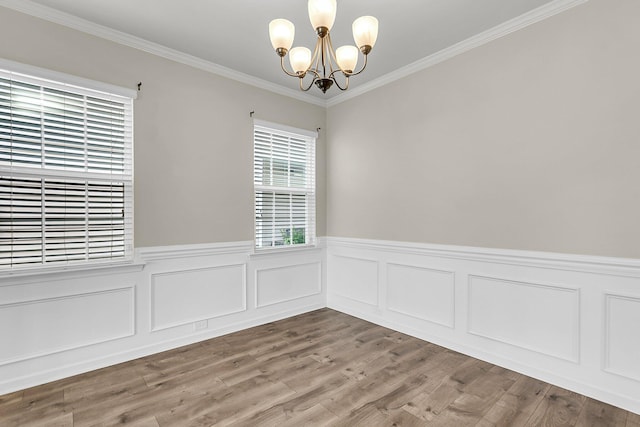 5138 Preserve Blvd, Ladson, SC 29456 - empty room featuring a chandelier, a wainscoted wall, ornamental molding, and wood finished floors