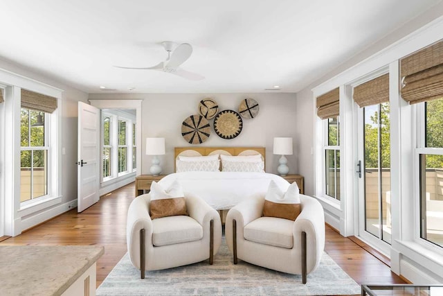 bedroom featuring recessed lighting, a ceiling fan, access to outside, and light wood-style floors
