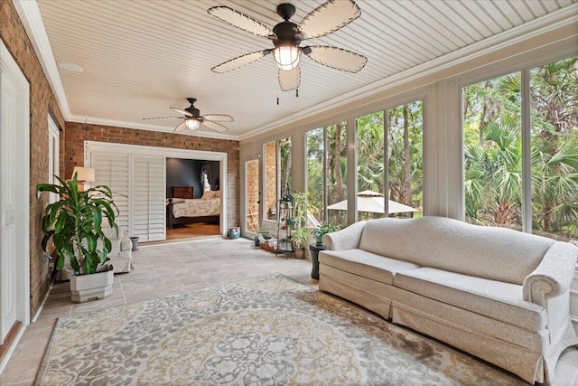 sunroom / solarium featuring crown molding