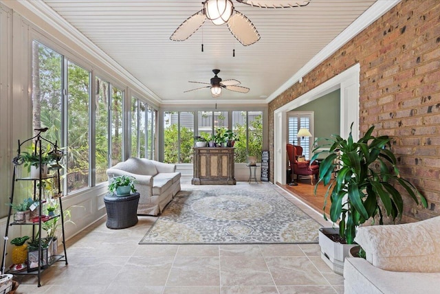 sunroom featuring plenty of natural light and ceiling fan