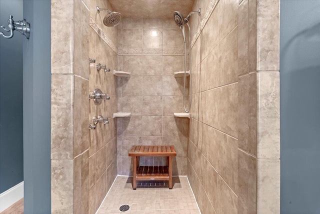 bathroom featuring a tile shower