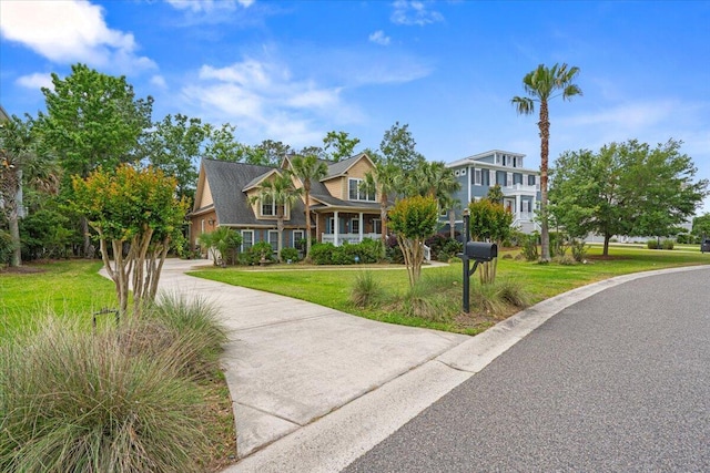 view of front of house with a front lawn and driveway