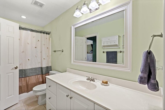 full bath featuring toilet, vanity, tile patterned floors, and curtained shower