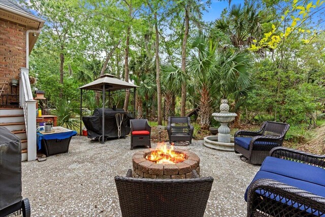 view of patio with a fire pit and grilling area