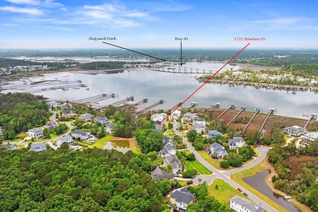 aerial perspective of suburban area with a large body of water