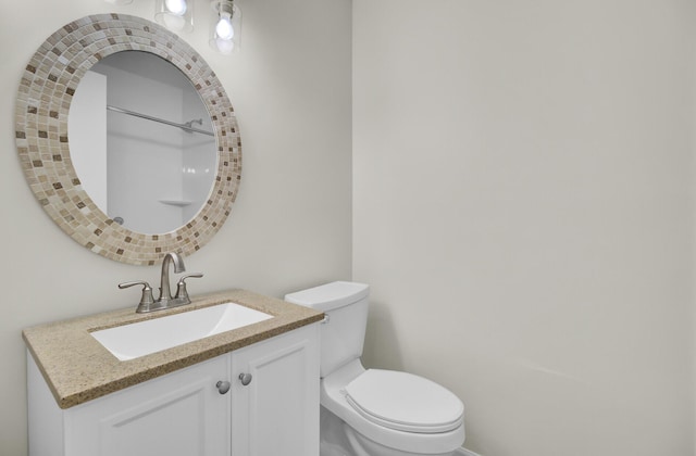 bathroom with toilet and vanity