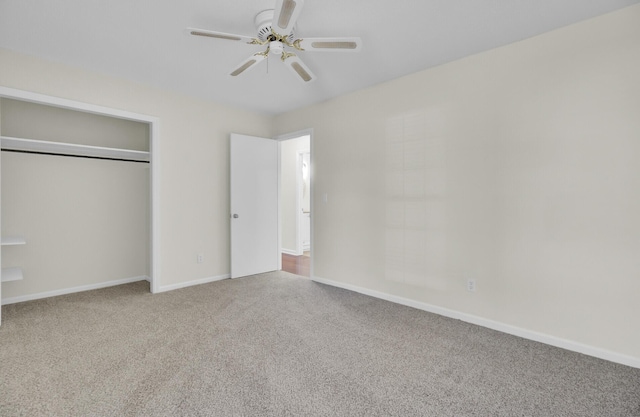 unfurnished bedroom with a closet, carpet flooring, a ceiling fan, and baseboards