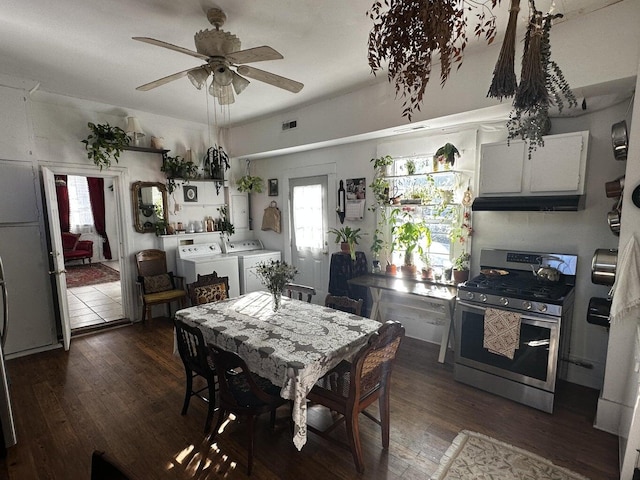 dining room with washer and clothes dryer, dark hardwood / wood-style floors, and ceiling fan