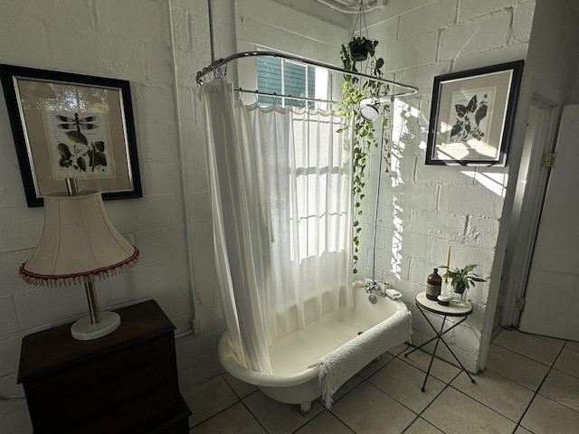 bathroom featuring tile patterned flooring and shower / tub combo with curtain