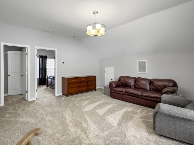 carpeted living room featuring vaulted ceiling