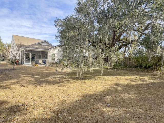 view of yard featuring a sunroom