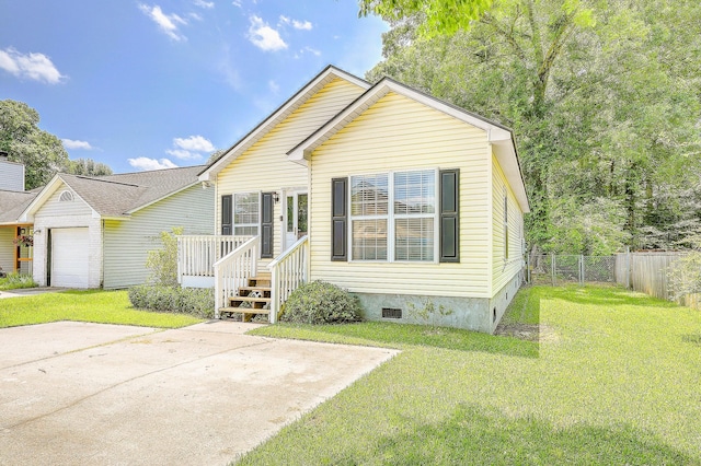 view of front of house with a garage and a front yard