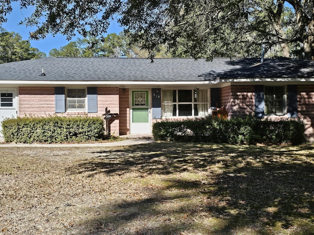 ranch-style home with a front yard