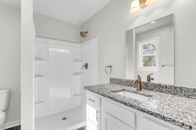 2711 Henry St, North Charleston, SC 29405 - bathroom with toilet, a shower, and vanity