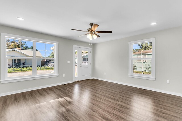 2711 Henry St, North Charleston, SC 29405 - unfurnished living room with dark wood finished floors, healthy amount of natural light, baseboards, and recessed lighting